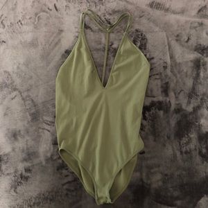A green Free People bodysuit